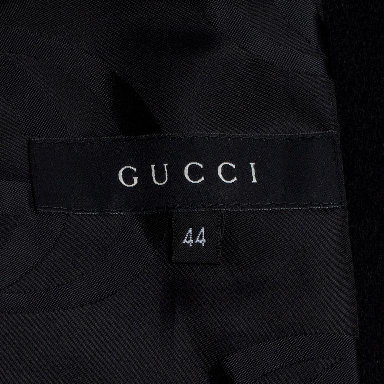 GUCCI, a black wool blend coat.