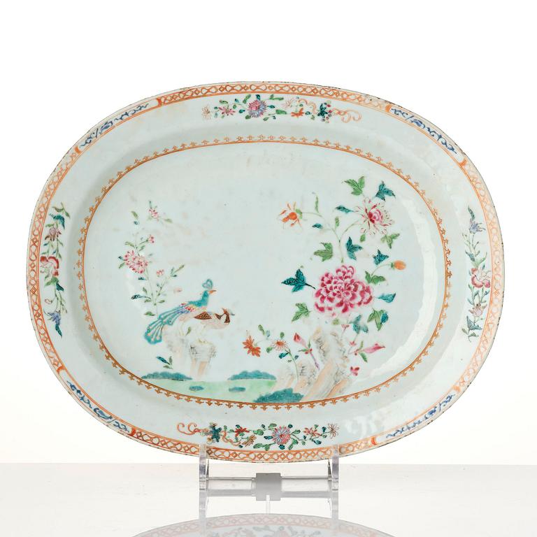 A group of famille rose 'double peacock' serving dishes, Qing dynasty, Qianlong (1736-95). (8 pieces).