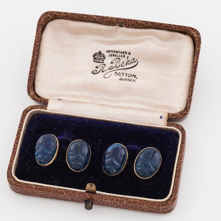 A pair of carved lapis lazuli cufflinks.