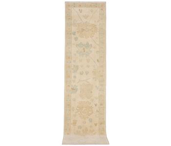 An Ushak runner carpet, c. 360 x 80 cm.