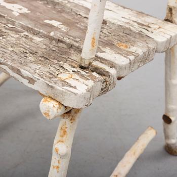 a pair of early 20th century garden cast iron chairs.