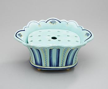 An Arthur Percy creamware vase.