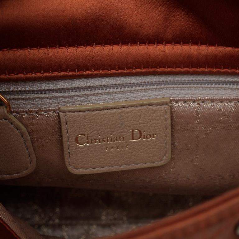 CHRISTIAN DIOR, an orange silk handbag.