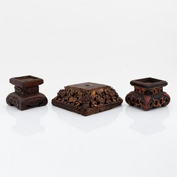 A set of three carved wooden stands, early 20th Century.