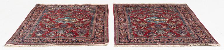 A pair of semi-antique pictoral Kashan rugs, ca 200 x 130 and 197 x 128 cm.