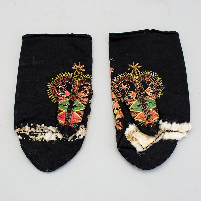 A pair of 19th century folk art brides mittens and a congratulation picture.