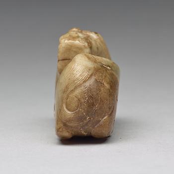 A carved nephrite figure, Ming dynasty (1368-1644).