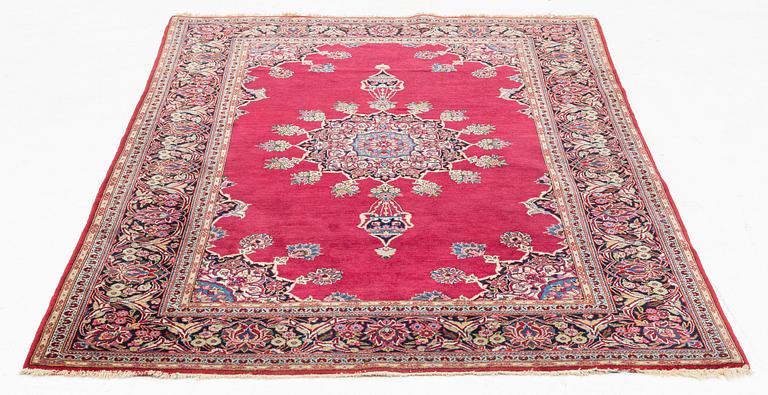 An oriental rug, c. 205 x 133 cm.