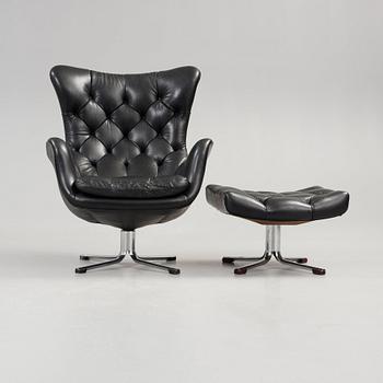 A Gustav Axel Berg 'Status' black leather easy chair with ottoman, Bröderna Andersson 1960's-70's.