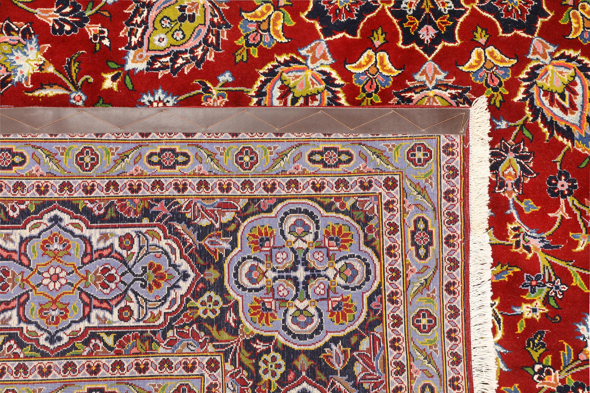 A Keshan carpet, part silk, signed, approx. 398 x 270 cm.