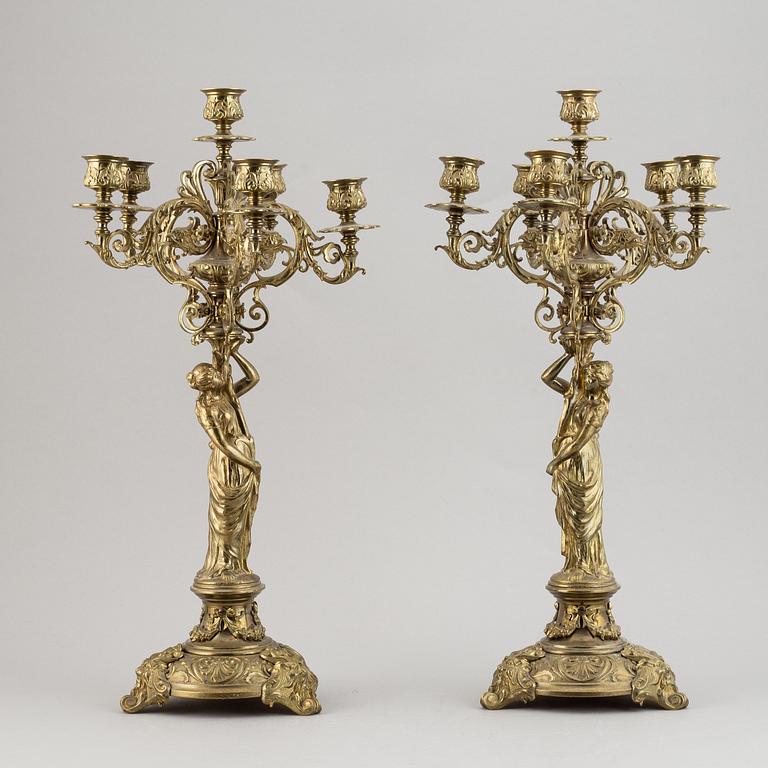 A pair of late 19th century brass candelabra for six candles.