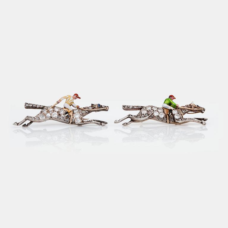 A pair of old-cut diamond and enamel brooches in the shape of jockeys on horses. Circa 1930's.