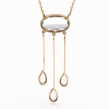 An 18K and 14K gold necklace with aquamarines.