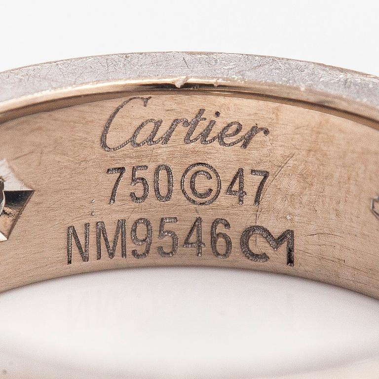 Cartier, an 18K white gold 'Love' ring with three brilliant-cut diamonds.