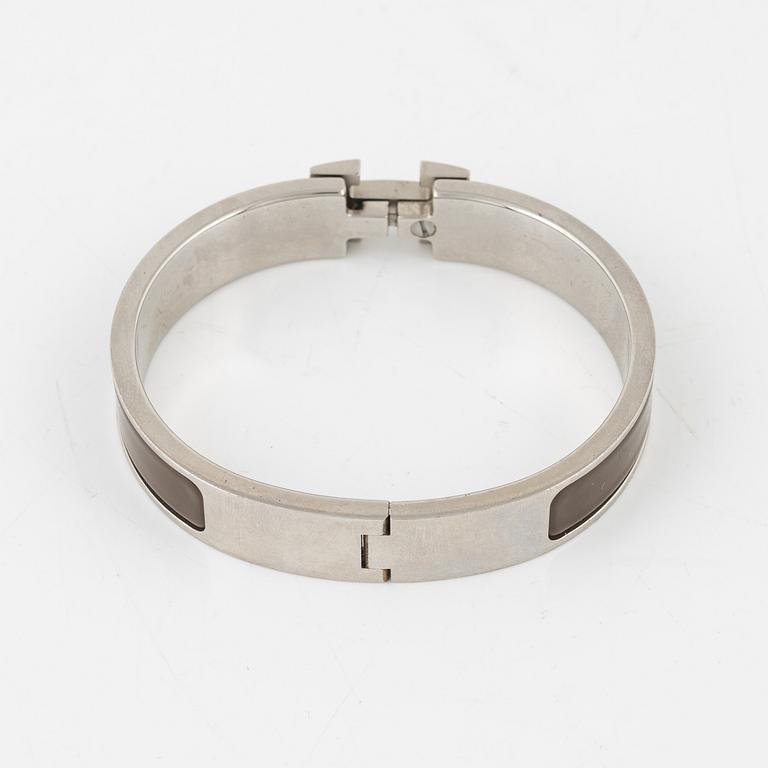 Hermès, a 'Clic H' bracelet.