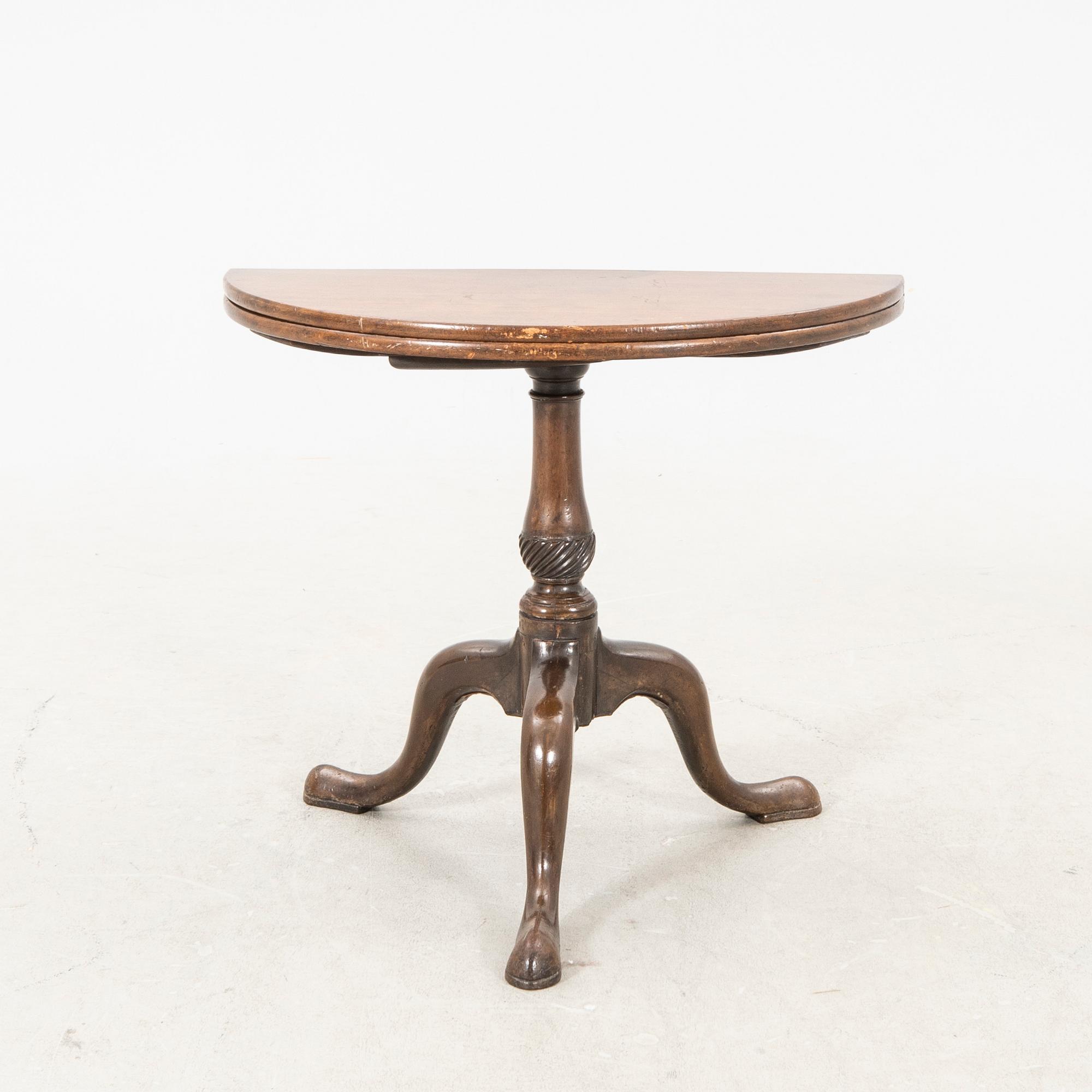 An English Queen Anne mahogany folding table 18th century.