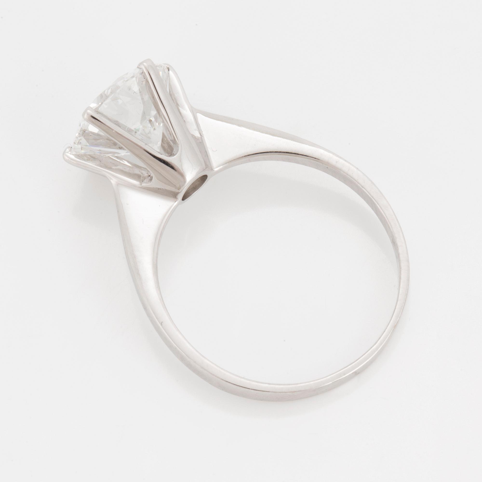 A SOLITAIRE RING set with a round brilliant-cut diamond.
