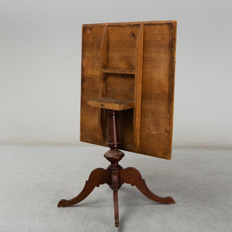 A 19th century tilt top table.