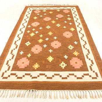 Anna-Greta Sjöqvist, a signed flat weave carpet approx 309x197 cm.