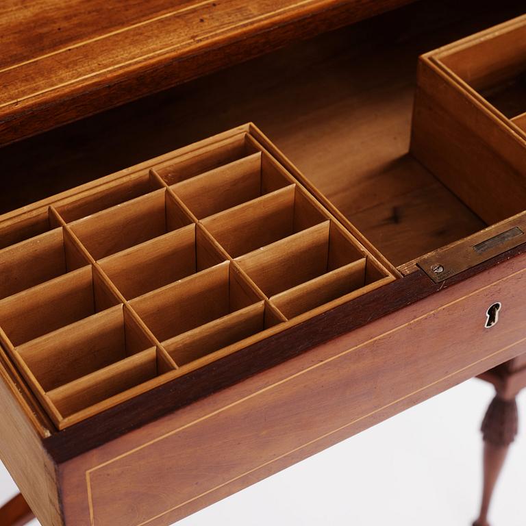 A late Gustavian mahogany table attributed to L. Qvarnberg (master in Stockholm 1801-1813).