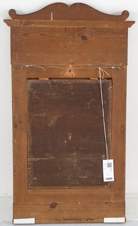 A birch veneered Swedish mirror, late empire, mid 19th Century.