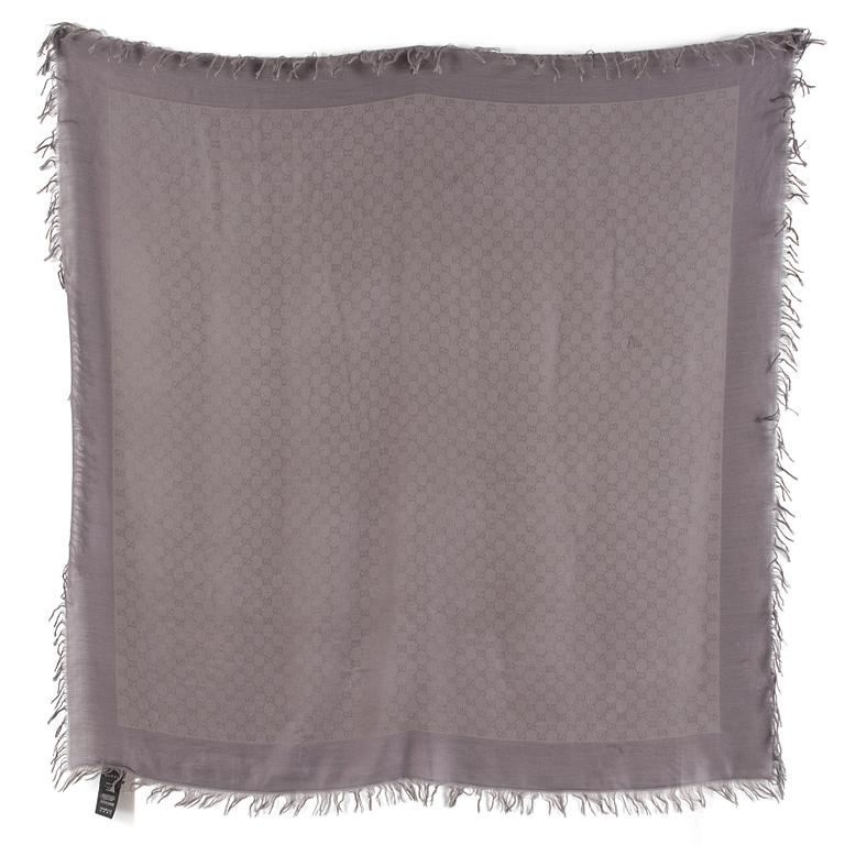 A shawl by Gucci.