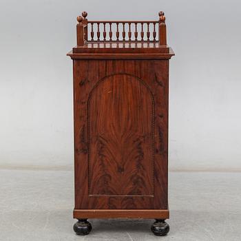 A Swedish Empire cupboard, first half of the 19th century.