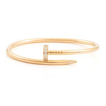 507. A Cartier "Juste un Clou" bracelet in 18K gold set with round brilliant-cut diamonds.