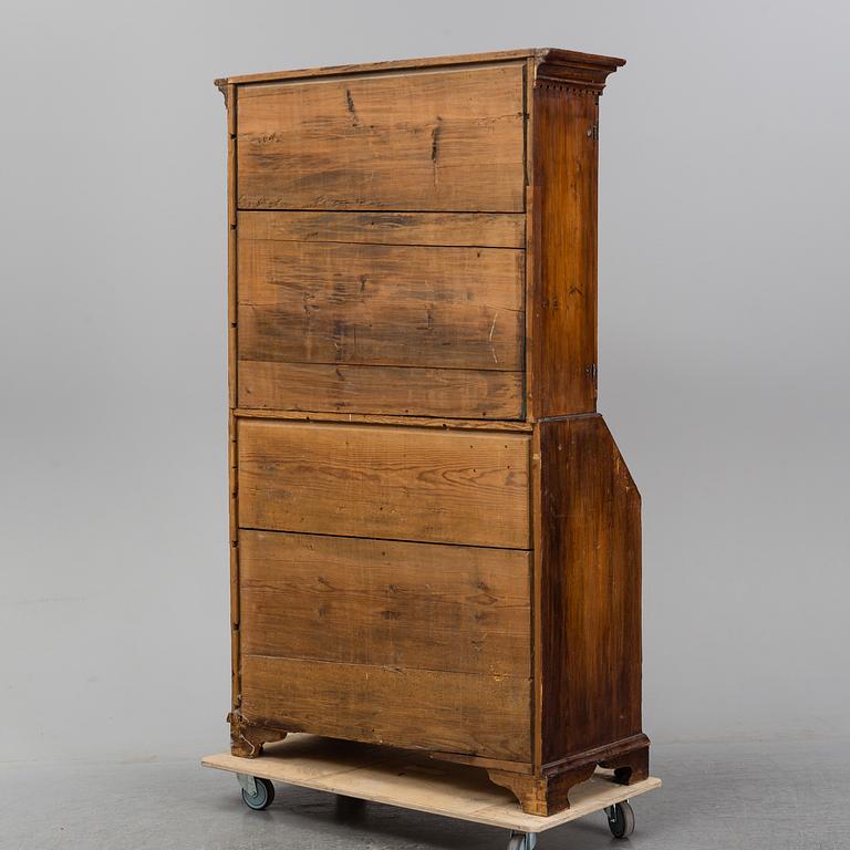 An early 19th Century pine cabinet.