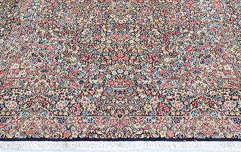 A Kirman Laver 'Millefleur' carpet, approx. 342 x 245 cm.