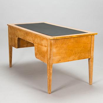 A late 19th-century curly birch veneered writing desk.