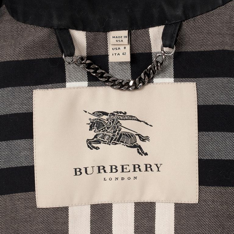 BURBERRY, a black cottonblend ladies trenchcoat. UK size 10.