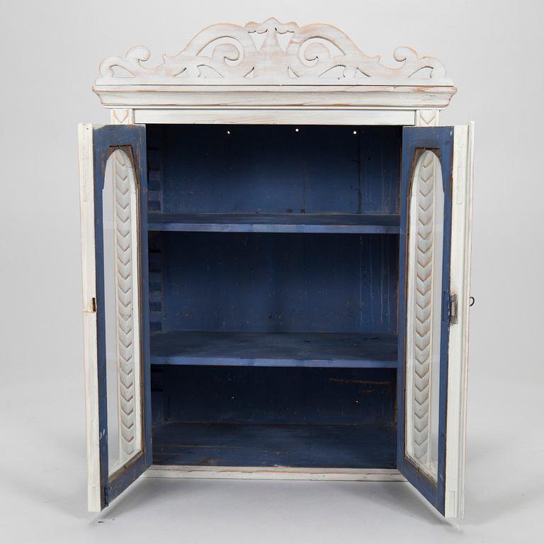 A late 19th-century wooden wall cabinet.