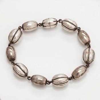 Kalevala Koru, a set of sterling silver "Halikko treasure" necklace, bracelet, ring and earrings. Helsinki 1994.