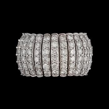 66. A flexible brilliant-cut diamond ring. Total carat weight circa 6.71 ct.