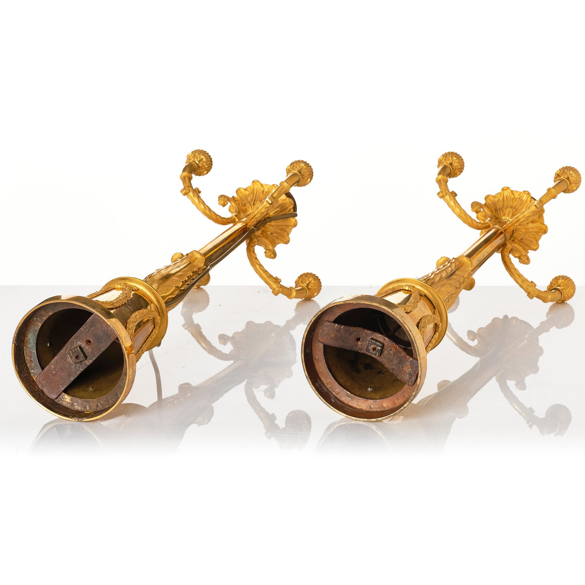 A pair of French Empire four-light candelabra (lamps), early 19th century.