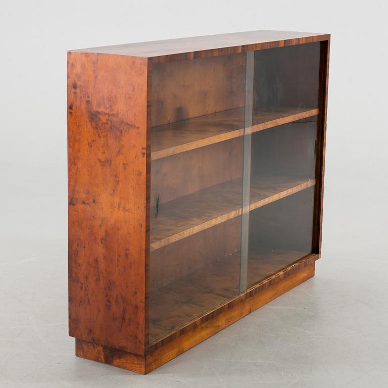 A 20Th CENTURY BOOKCASE.