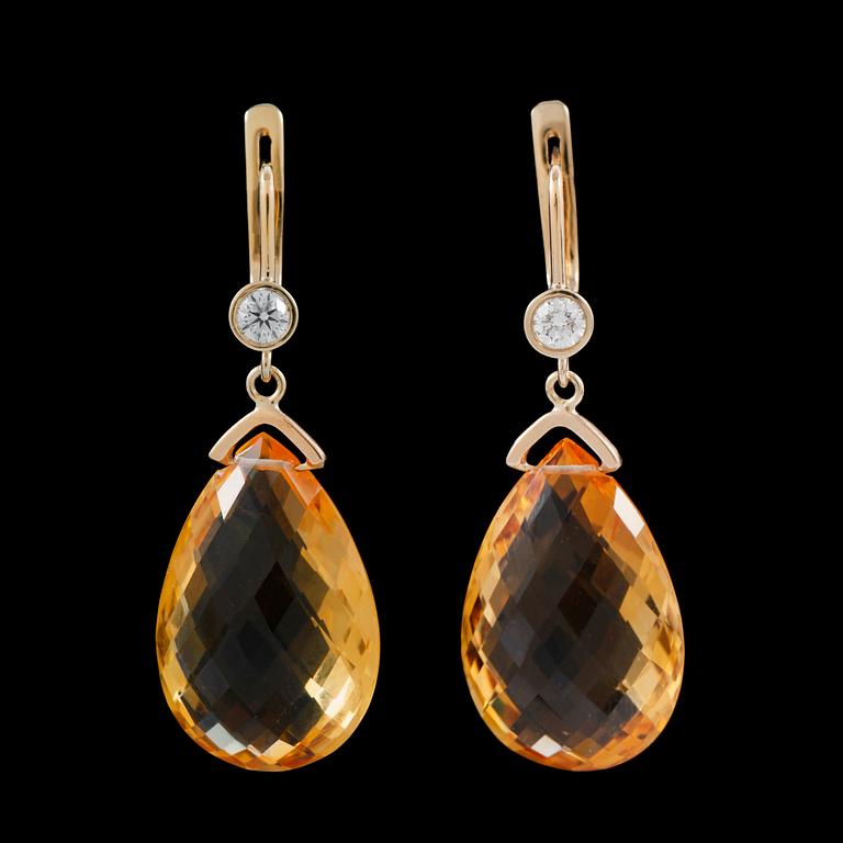 A pair of briolette cut citrins, total gem weight 36 cts, and diamond, total gem weight circa 0.40 ct.