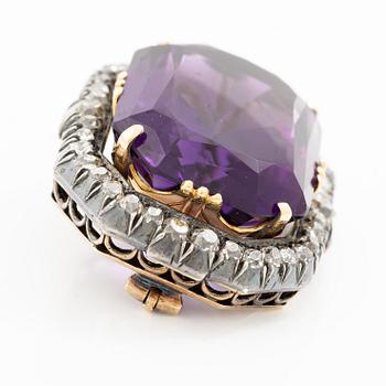 A brooch 14K gold and silver with a faceted amethyst and old-cut diamonds, 19th century.