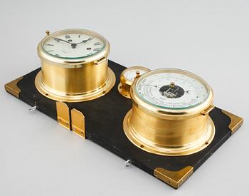 A barometer, clock and a hyglometer, 20th century.