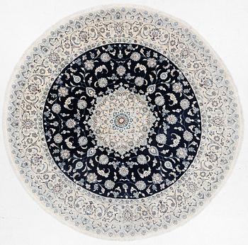 A Nain rug, diameter 243 cm.