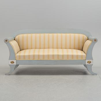 A mid 19th century painted sofa.