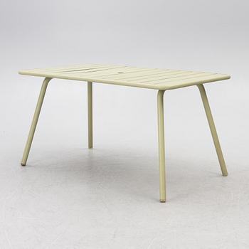Frédéric Sofia, a table and two chairs for outdoor use, "Luxembourg" Fermob, France, 21st century.