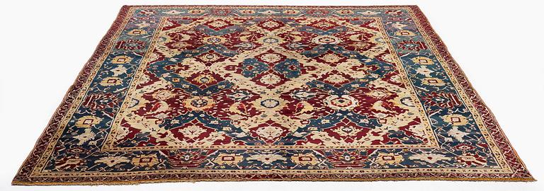 An Antique Agra carpet of 'Dragon Lattice' design, North India, 375 x 298 cm.