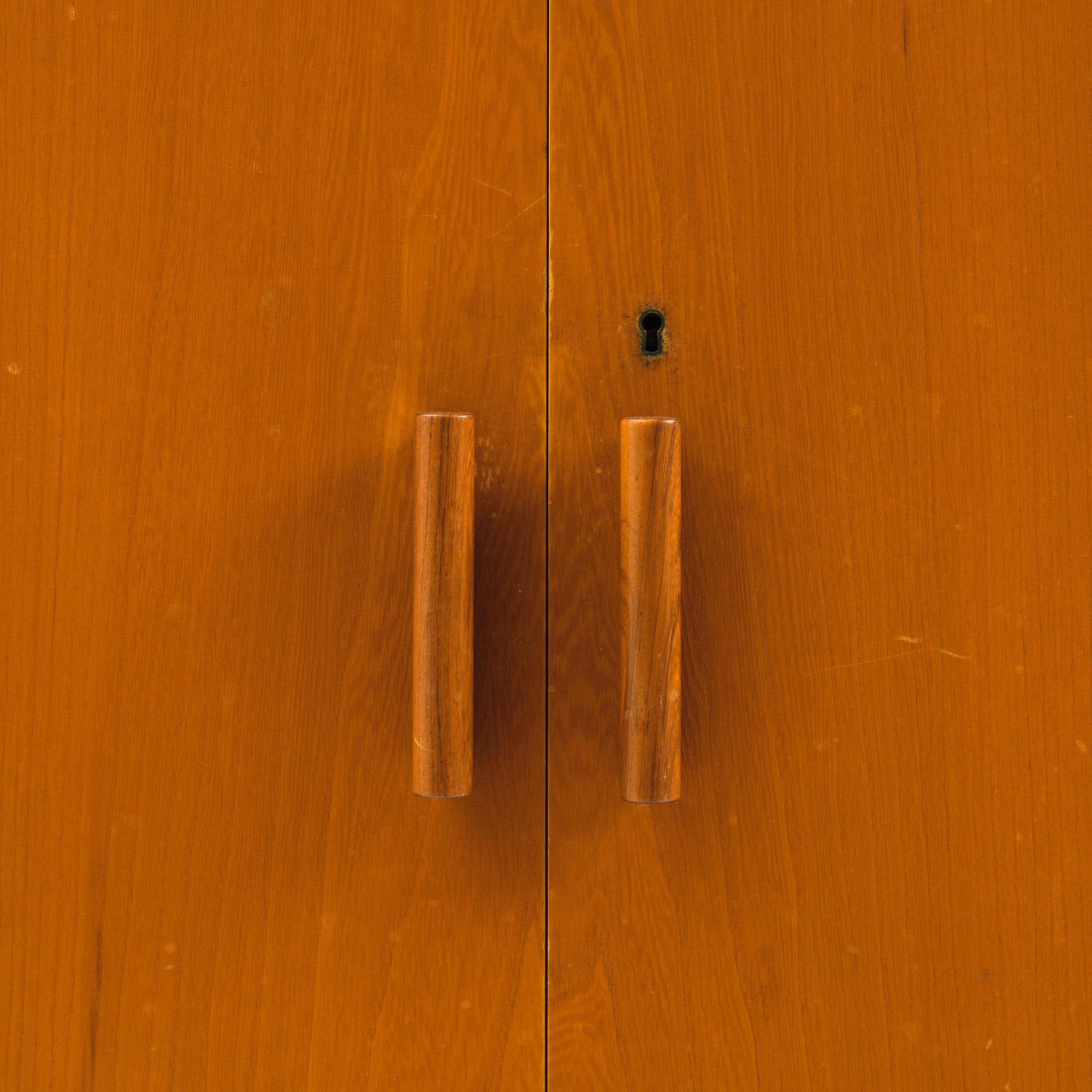 Nordiska Kompaniet, an elm veneered cabinet, Sweden, 1930s-40s.