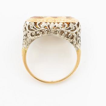 Gold ring with synthetic yellow sapphire.