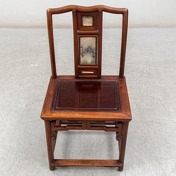 A pair of Chinese hardwood armchairs, early 20th century.