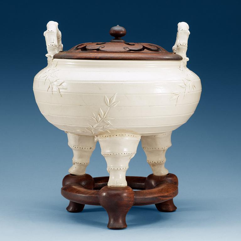 A large white glazed ceramic tripod censer, Qing dynasty, 19th Century, with Chenghua six character mark.