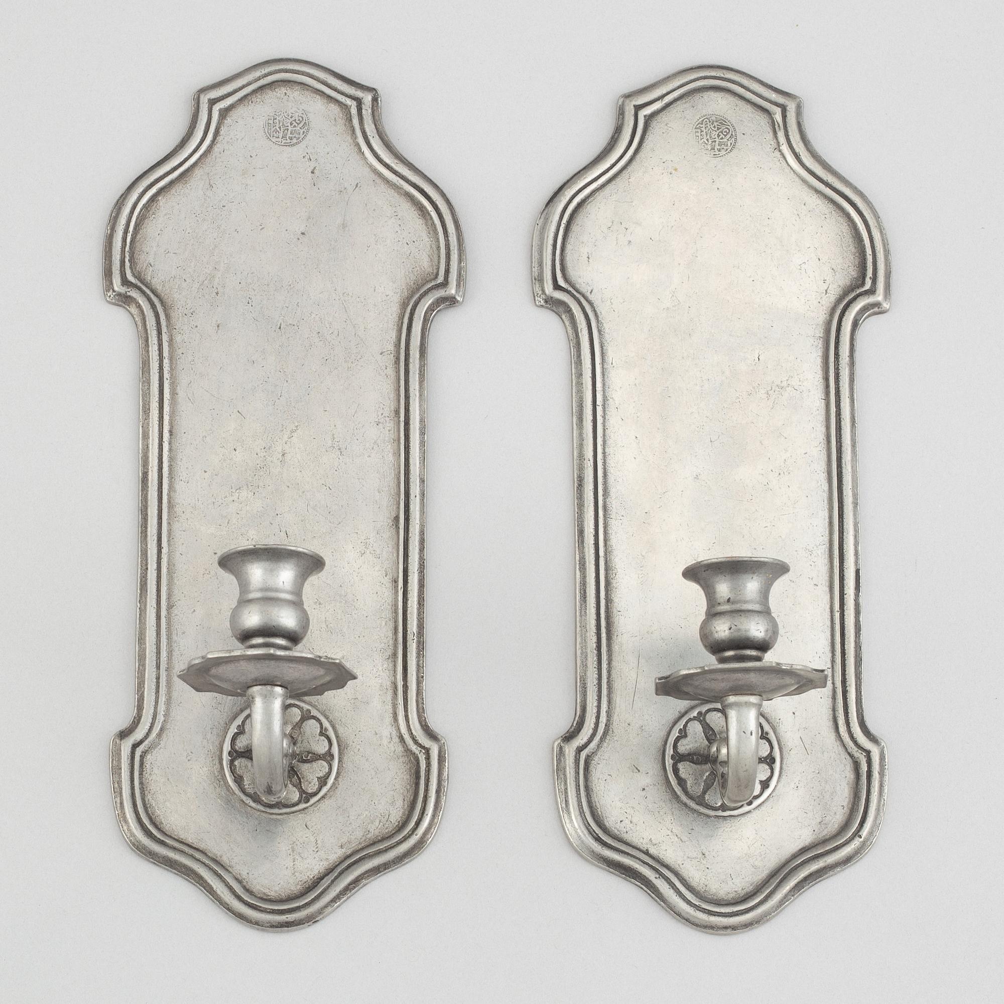 A pair of pewter wall sconces, 1920's/30's.