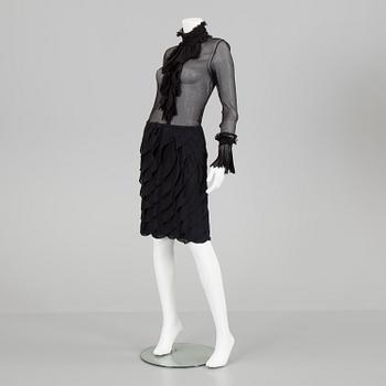 A skirt, topp and a blause by Ralph Lauren.